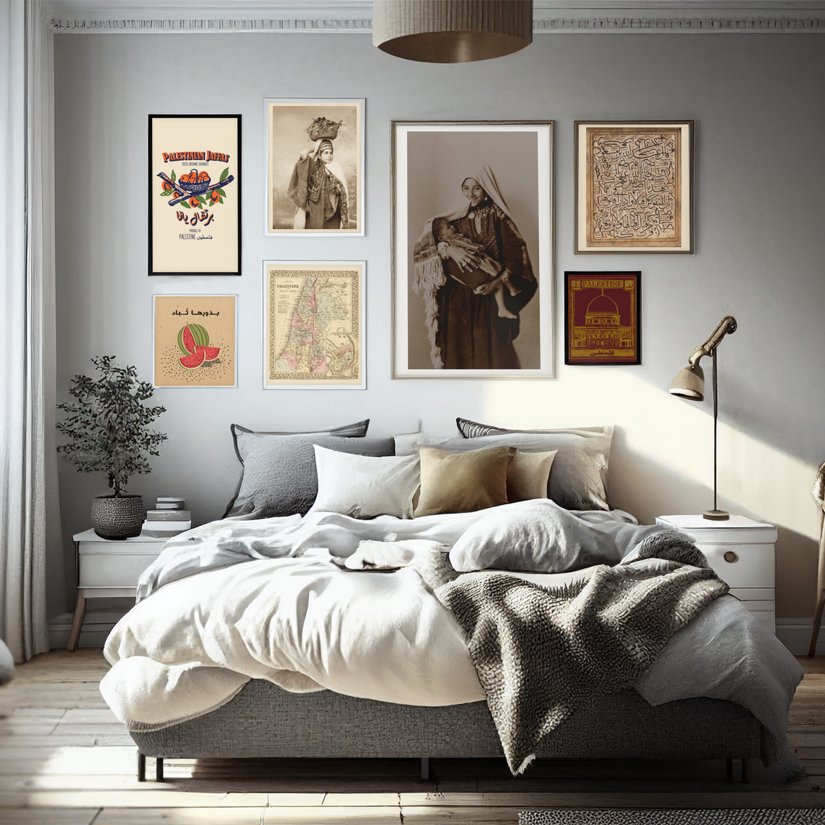 Framed Native Threads art prints and historic photographs arranged above a bed