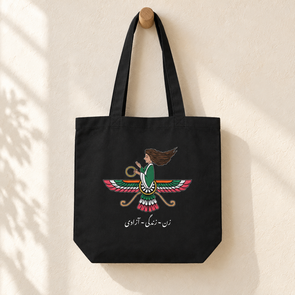 Iranian Farvahar Woman Life Freedom Tote Bag, hanging from a wooden peg with the printed front visible.