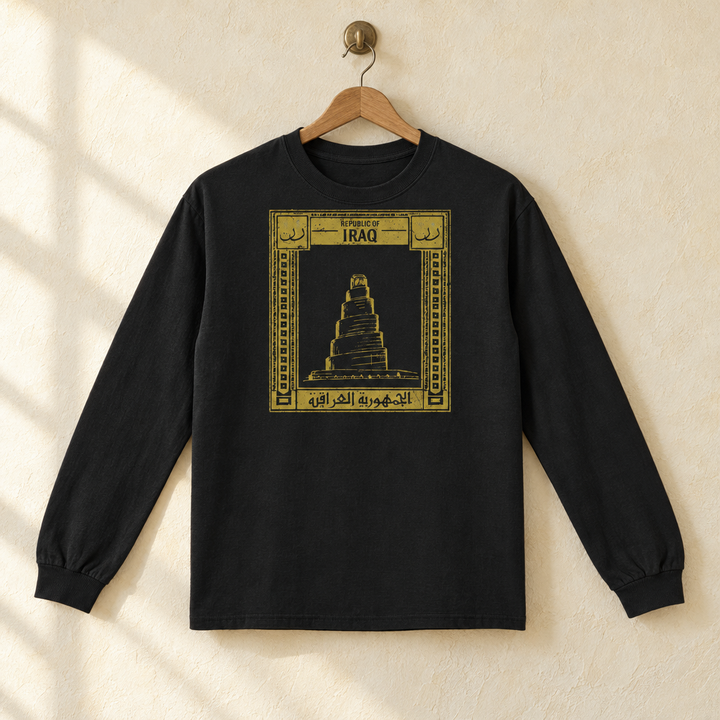 Iraq Postcard Long Sleeve, hanging on a wooden hanger against a pale wall.