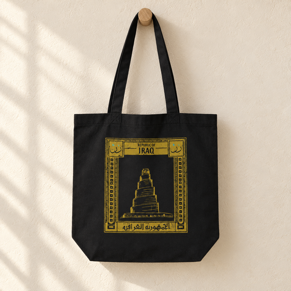 Iraq Postcard Tote Bag, hanging from a wooden peg with the printed front visible.