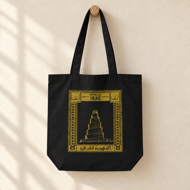 Iraq Postcard Tote Bag, hanging from a wooden peg with the printed front visible.