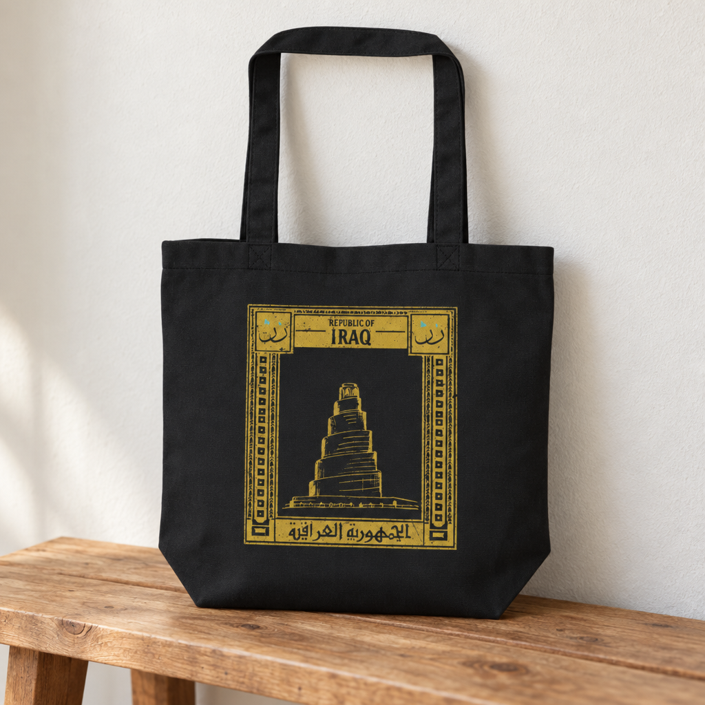 Iraq Postcard Tote Bag, standing on a wooden bench with the printed front visible.