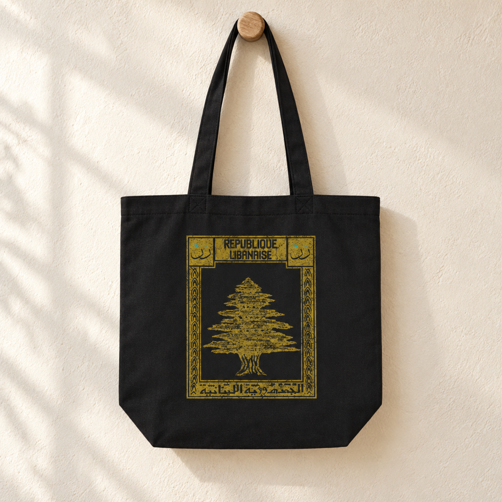 Lebanon Postcard Tote Bag, hanging from a wooden peg with the printed front visible.