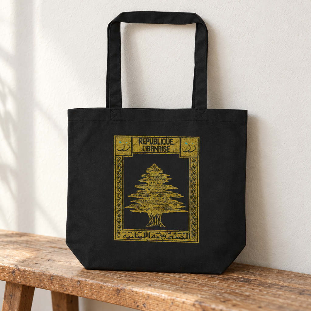 Lebanon Postcard Tote Bag, standing on a wooden bench with the printed front visible.
