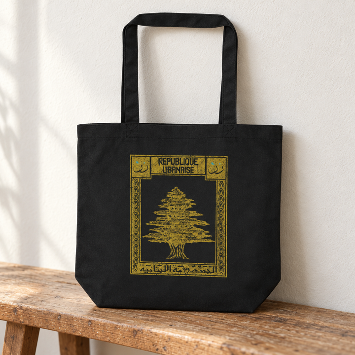 Lebanon Postcard Tote Bag, standing on a wooden bench with the printed front visible.