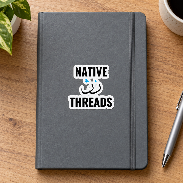 Native Threads Sticker, applied to a plain notebook on a desk.