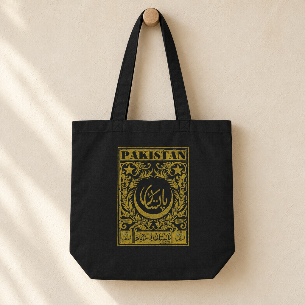 Pakistan Postcard Tote Bag, hanging from a wooden peg with the printed front visible.