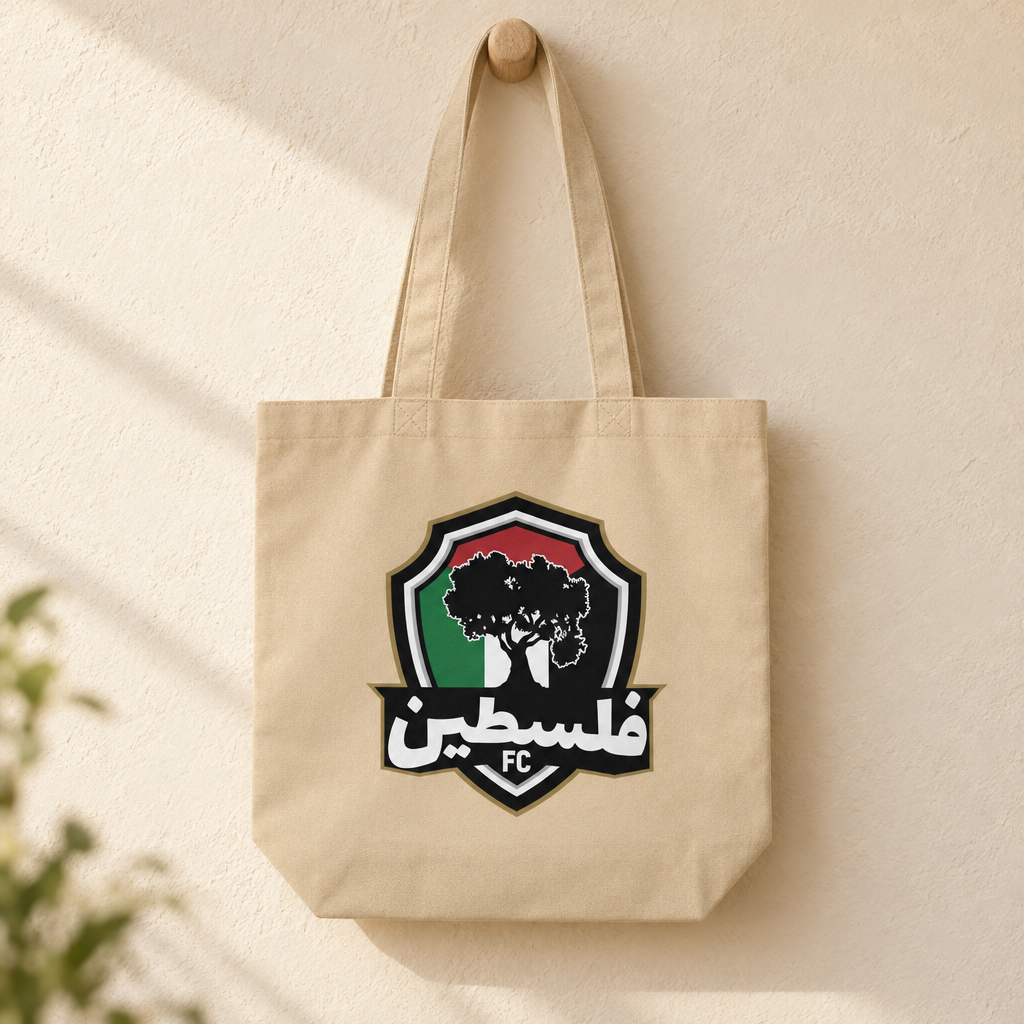 Palestine FC Eco Tote Bag, hanging from a wooden peg with the printed front visible.