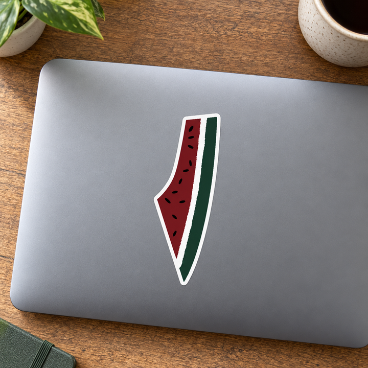 Palestine Watermelon Map Sticker, applied to a closed laptop on a desk.