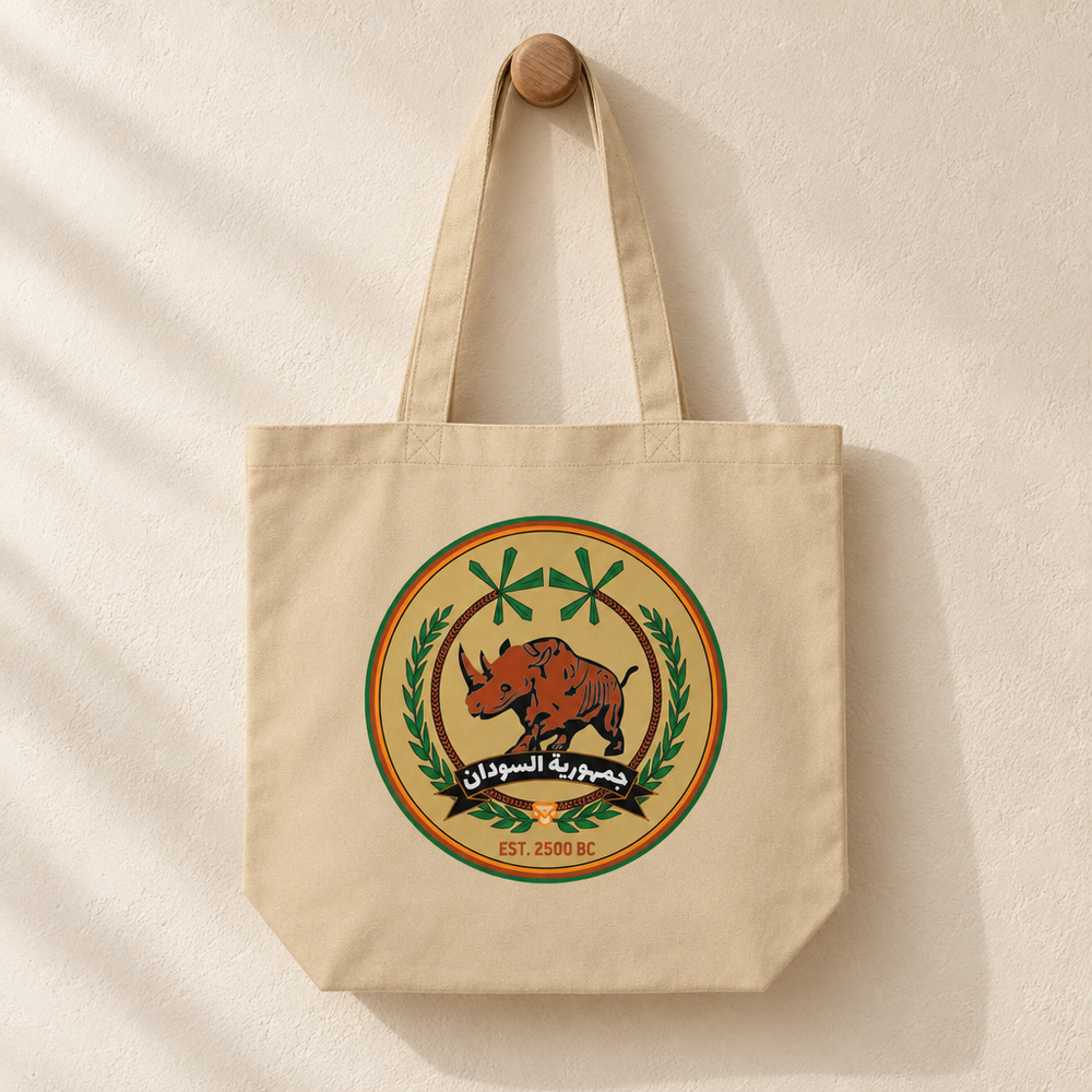 Sudan FC Eco Tote Bag, hanging from a wooden peg with the printed front visible.