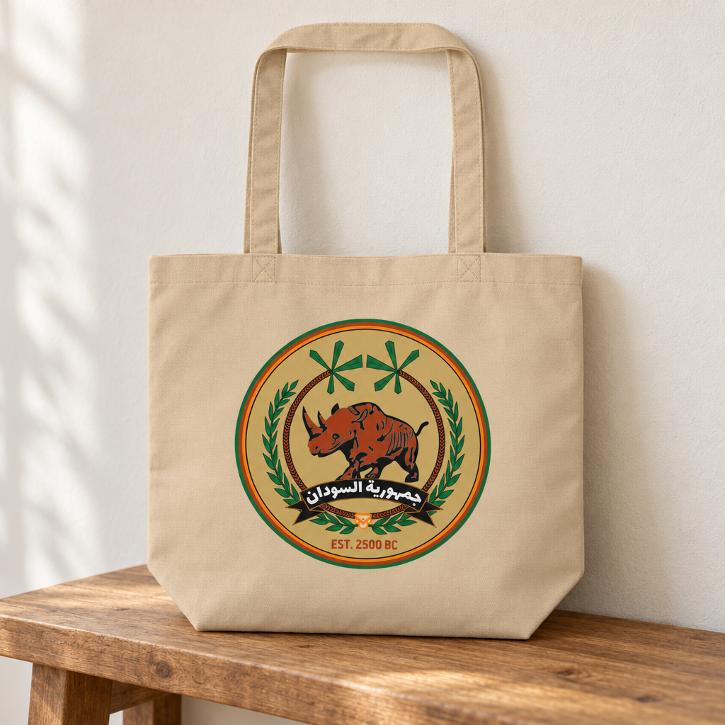 Sudan FC Eco Tote Bag, standing on a wooden bench with the printed front visible.
