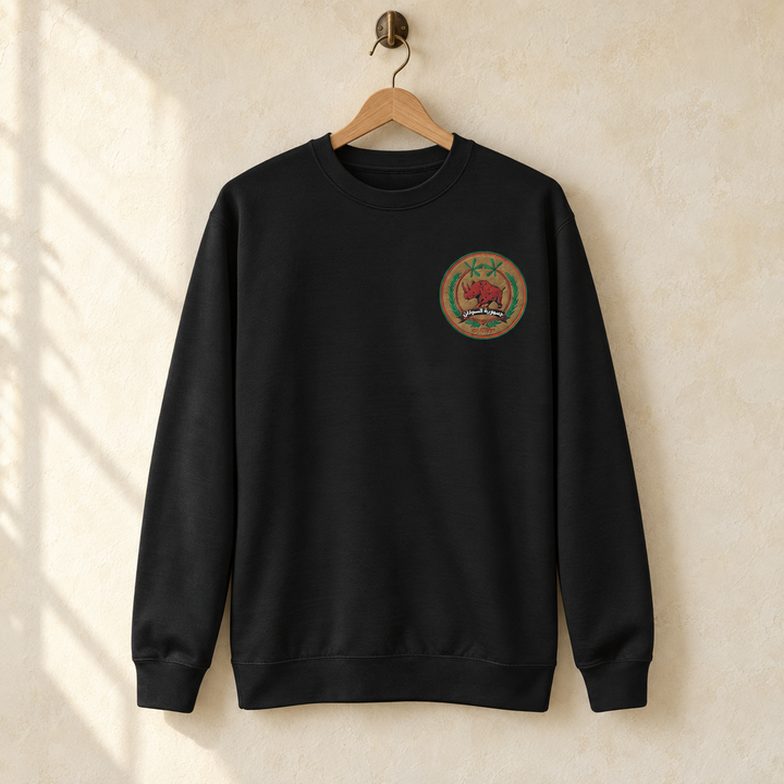 Sudan FC Sweater, hanging on a wooden hanger against a pale wall.