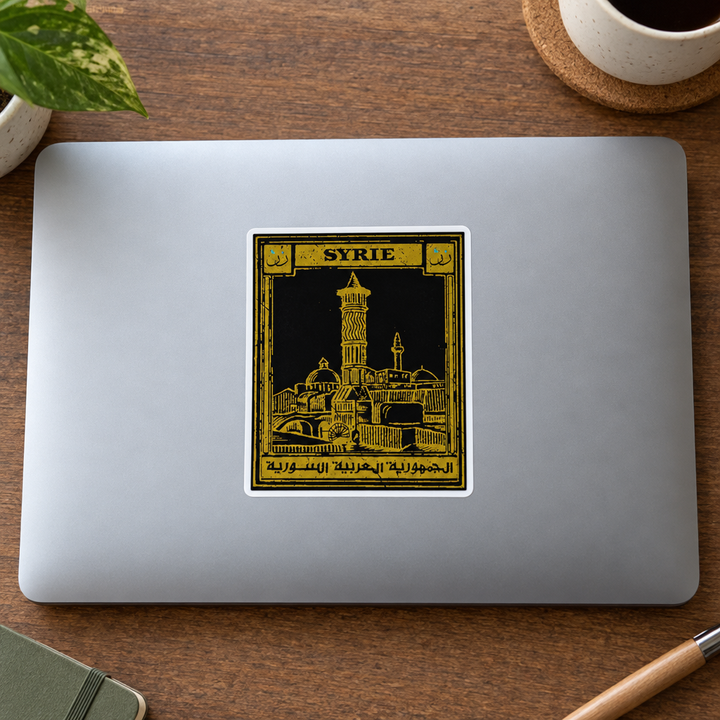 Syria Postcard Sticker, applied to a closed laptop on a desk.